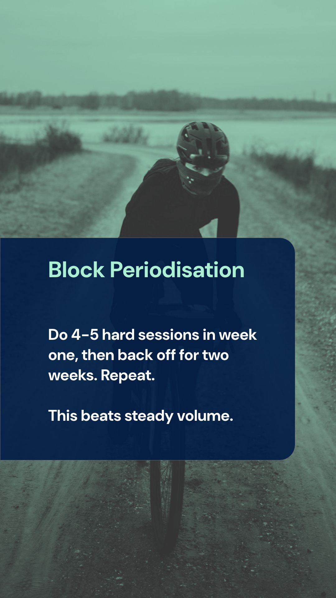 Cyclist performing high-intensity interval training on winter road