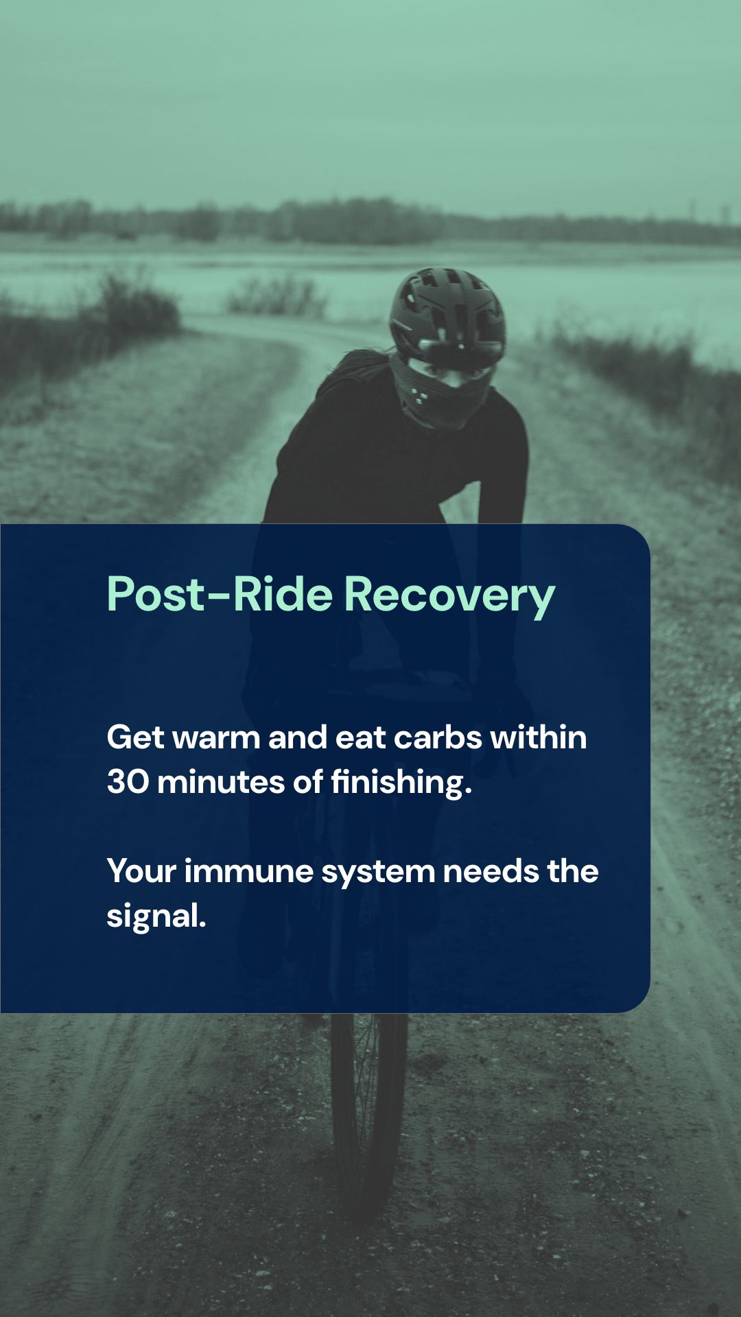 Cyclist warming up indoors after winter ride with recovery drink and food